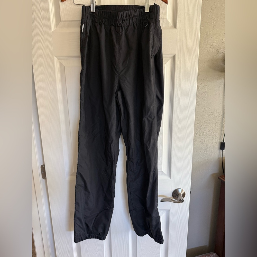 Vintage Obermeyer fill side zip ski shells with adjustable waist tabs.